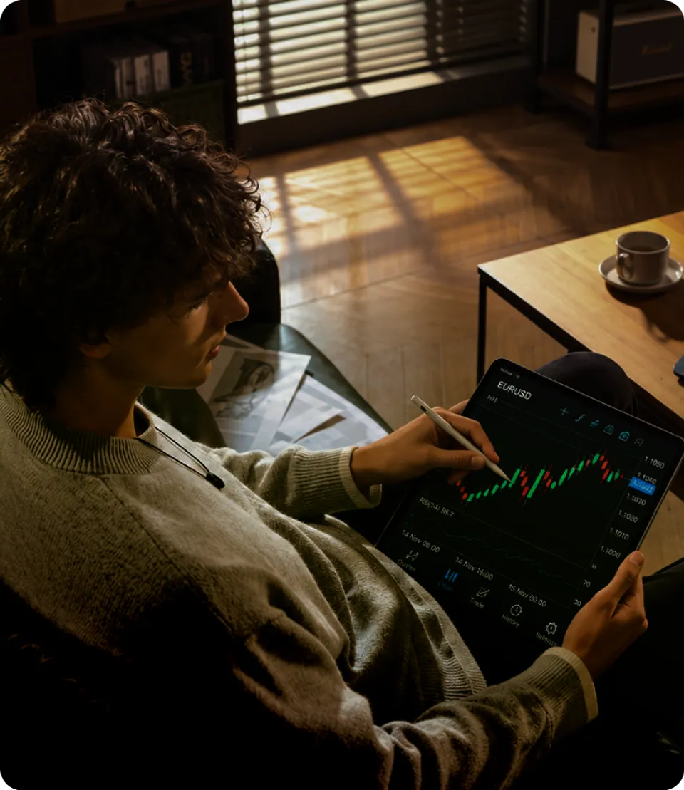 Trader reviewing charts on a tablet